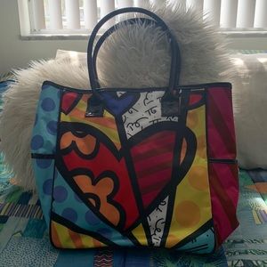 Stylish modern art inspired multi colored vinyl handbag with patent leather.